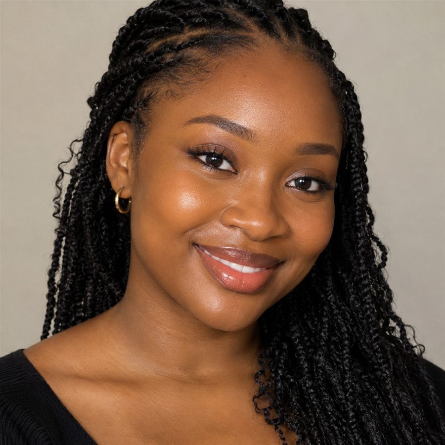 A smiling woman with fresh natural makeup and glowing skin